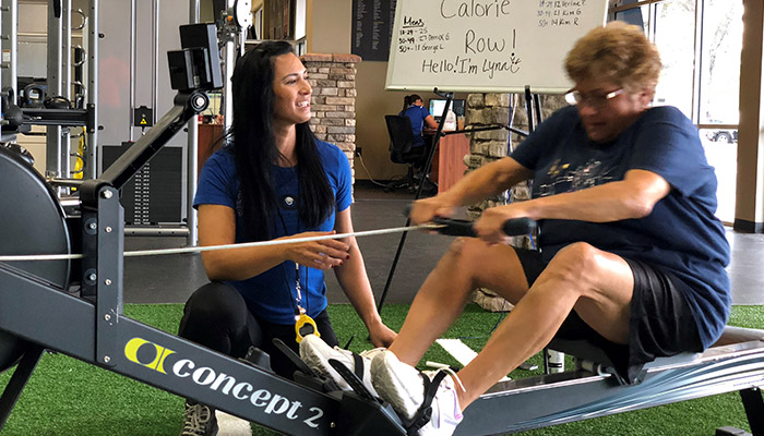 personal training on fitness rowing machine